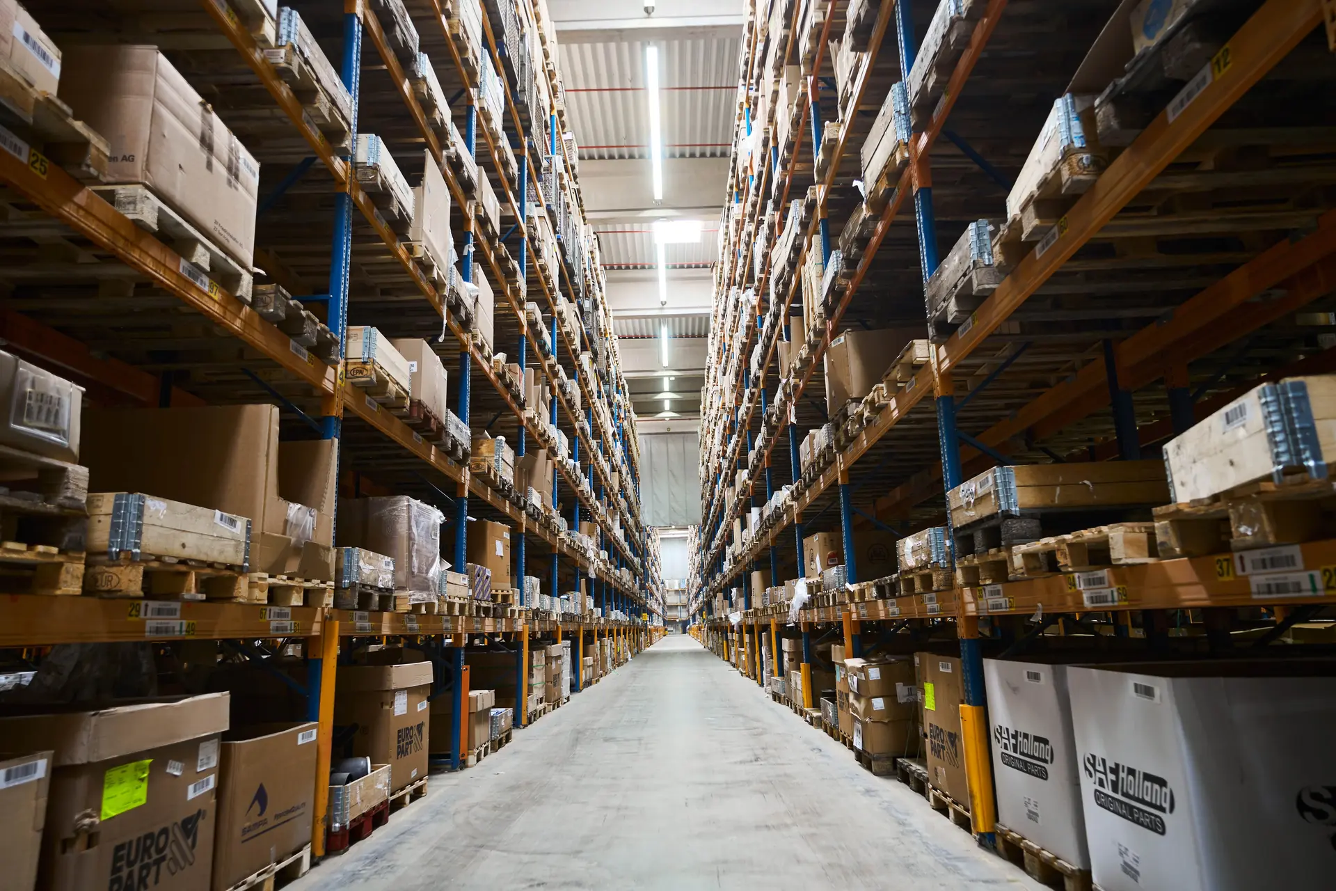 Aisle of a warehouse with high racks